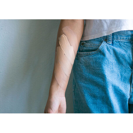 Swatches on an arm of Dermafinish Corrective Fluid High Coverage Foundation Shades: Opal, Nude, Sand, Gold